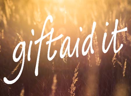 Gift Aid: Image of field with words 'Gift Aid' written over it